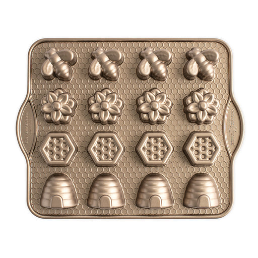 Nordic Ware | Busy Bee Bitelet Pan with 16 bee and flower-shaped cavities for creating festive, bite-sized treats, ideal for spring and summer gatherings.