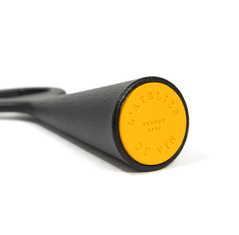 L'Atelier du Vin - USA - Bottle Opener - LE BRASSEUR – BLACK, featuring a stainless steel body with a yellow end cap, ideal for effortless bottle-opening.