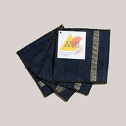 ATELIER SAUCIER - Grecian Cocktail Napkins | Set of 4: Dark-denim napkins with gold Greek-key edges, showcasing reclaimed, premium craftsmanship, ideal for elegant entertaining.