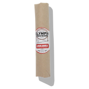 Olympia Provisions - Loukanika Salami wrapped in butcher paper; a Greek-inspired salami with cumin, garlic, and orange zest, showcasing natural mold on its casing.