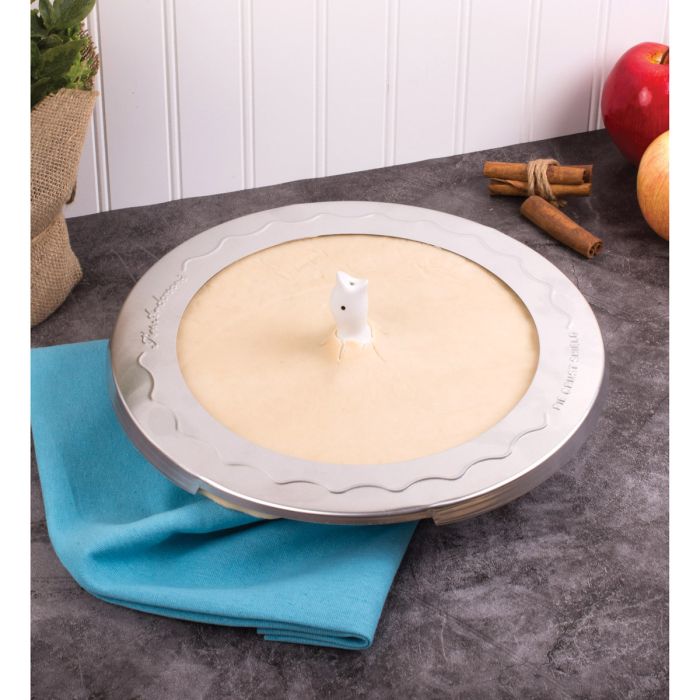 Harold Imports | Pie Bird, a decorative tool on a pie crust, surrounded by apples on a table, enhancing baking in Athens Cooks' kitchen collection.