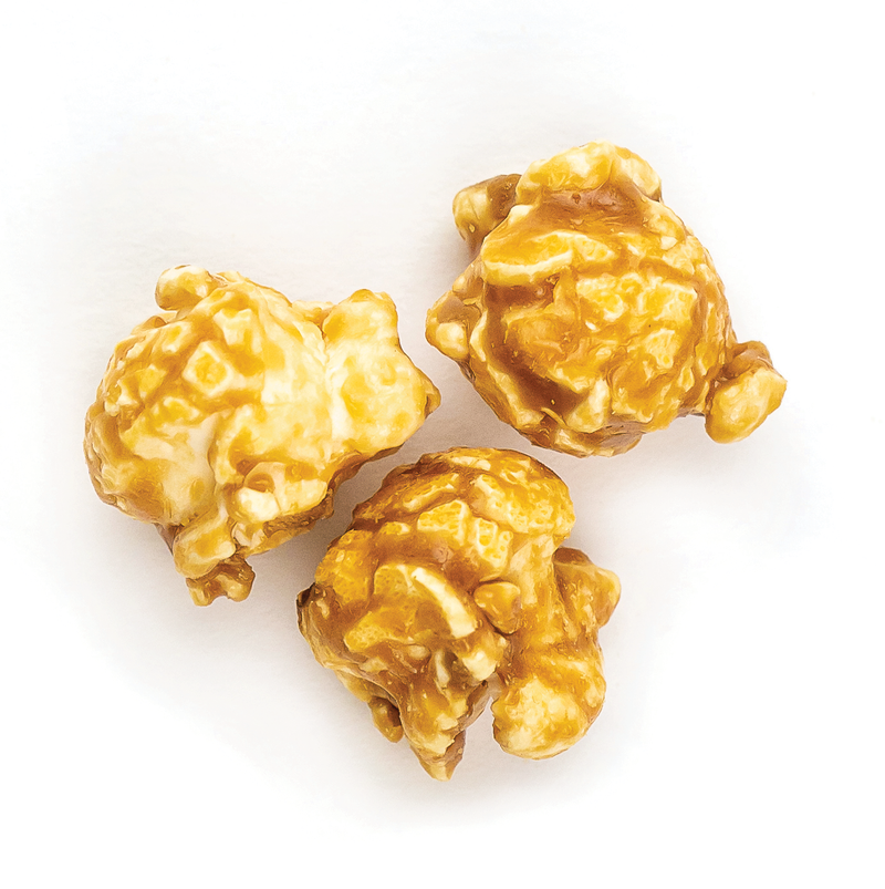 Poppy Hand-Crafted Popcorn - Pumpkin Spice Popcorn features three caramel-coated kernels, offering a taste reminiscent of pumpkin spice lattes.