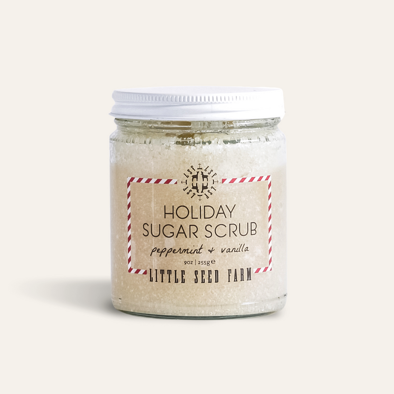 Little Seed Farm - Holiday Sugar Scrub in a clear jar with a white lid, featuring a festive peppermint-vanilla scent for smooth, soft skin.