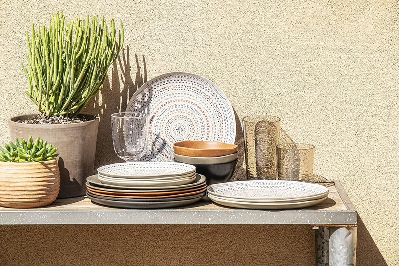 TarHong | Planta Matte Dinner Plate - Black, a stack of six white plates with organic edges, crafted from durable plant-based materials, ideal for versatile indoor or outdoor dining.