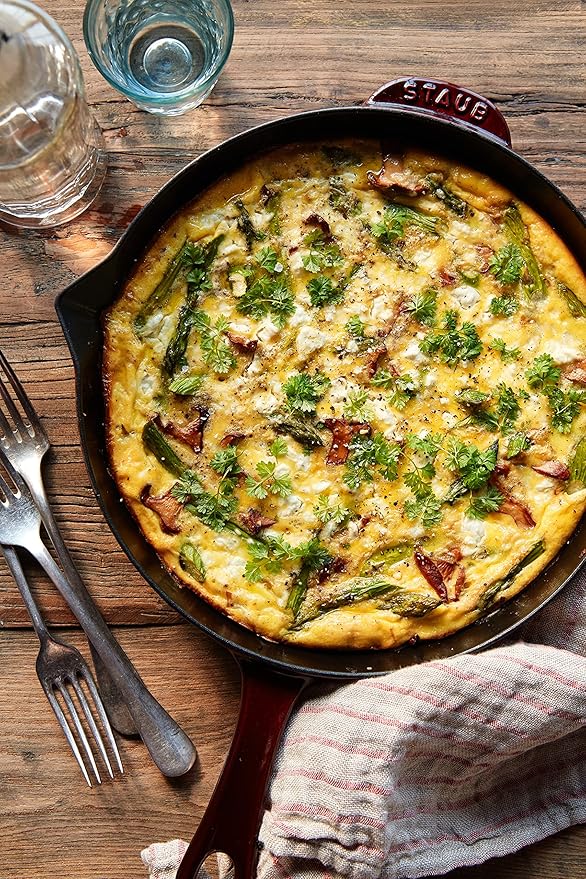 Staub Cast Iron Frying Pan, ideal for versatile cooking. This durable pan is a staple at Athens Cooks, reflecting quality and expert craftsmanship in kitchen essentials.