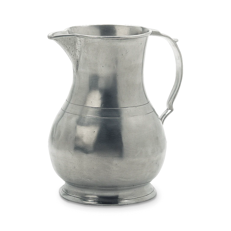 Match | Luciano Pitcher: A silver-gray metal jug with a handle and tapered spout, featuring a classic, bulbous form on a pedestal base, ideal for kitchen use.