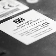 Label on Dualit 4 Slice Classic Toaster, Polished, highlighting Hand Built in Great Britain with repairability features, reflecting Athens Cooks' dedication to quality kitchen appliances.
