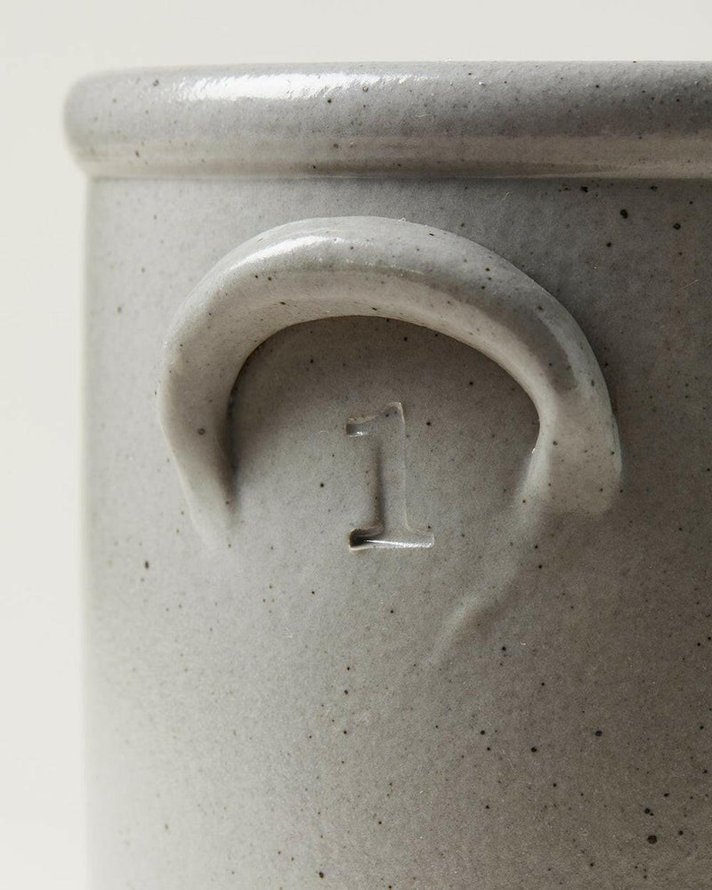 Farmhouse Pottery Agrarian Crocks - 1 Gallon - Stone with hand-stamped volume on handle, featuring a textured exterior with iron flecking for visual depth.