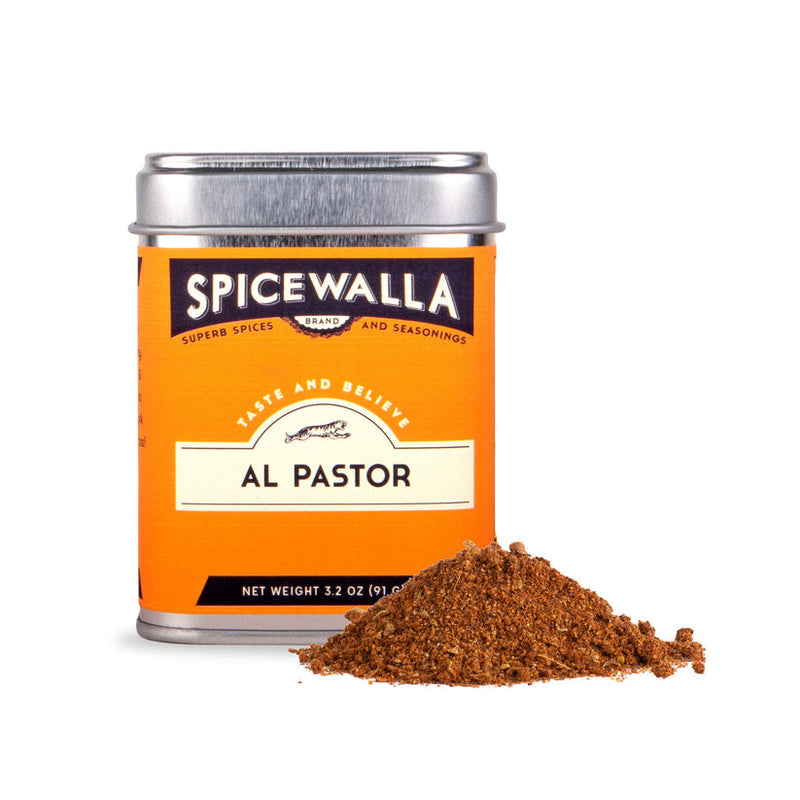 Spicewalla | Al Pastor Rub tin with a small pile of reddish-brown spice blend in front, ideal for marinating meats or enhancing taco flavors.