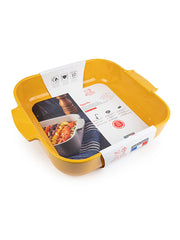 Peugeot | Appolia Square Baking Dish 14 inches, Saffron Yellow, with handles, shown brand-new with packaging, ideal for even cooking of meats and gratins.