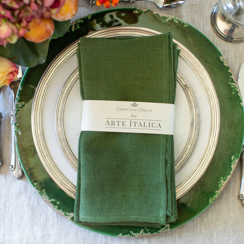 Crown Linen Designs' Royal Blue Washed Linen Napkin set elegantly arranged on a plate, enhancing your dining table with casual sophistication.