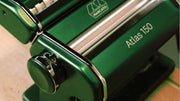Marcato | Atlas 150 Pasta Maker (Ice) displayed up-close, showcasing its mechanism for rolling and cutting pasta dough into lasagne, fettuccine, and tagliolini.