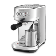 Breville | Bambino Plus espresso machine with portafilter and steam wand in action, ideal for crafting café-quality espresso and microfoam milk at home.