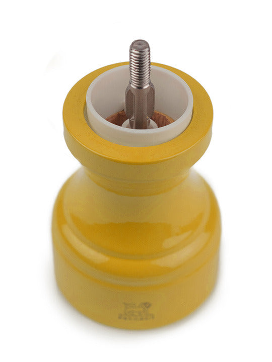 Peugeot | Bistro Salt Mill, Saffron: A classic wooden salt mill with a saffron yellow finish and durable metal mechanism, ideal for enhancing any kitchen setting.