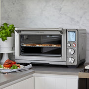 Breville | Smart Oven Air Fryer Pro on countertop with toasted bread, showcasing its air frying capability, perfect for culinary enthusiasts at Athens Cooks.