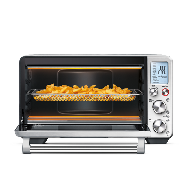 Breville | Smart Oven Air Fryer Pro with open door showing fries in basket, heating elements glowing, set to 400°F for 18 minutes.