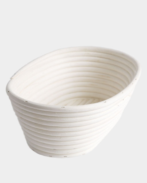 Breadtopia | Oval Rattan Bread Proofing Basket and Liner: An off-white, coiled rattan basket ideal for letting sourdough rise, sourced from a family-run Vietnamese operation.