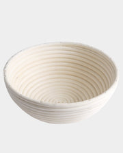 Breadtopia | Round Rattan Bread Proofing Basket and Liner shown empty, highlighting its concentric ridges for dough rising, ideal for artisanal baking.