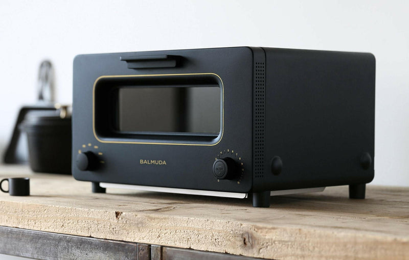 Close-up of BALMUDA | The Toaster - White, showcasing its sleek design tailored for precise, steam-enhanced toasting, ideal for Athens Cooks' curated kitchen collection.