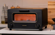BALMUDA | The Toaster - White, showcasing its innovative steam technology and precise heat control for perfect toasting results, ideal for enhancing culinary creations at home.