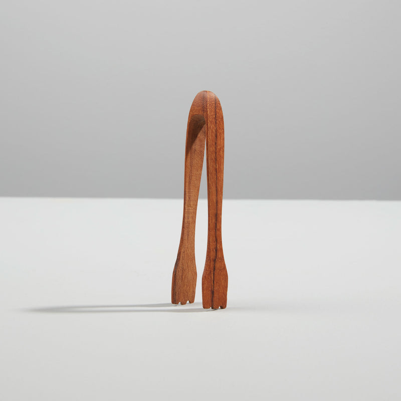 Be Home | Teak Tongs Mini, elegantly handcrafted, ideal for tea parties. Perfectly pairs with the Mini Teak & Glass Honey Jar for a charming kitchen setup.