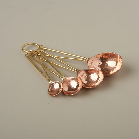 Be Home | Camden Measuring Spoons, expertly handcrafted in copper, add warmth and uniqueness to your kitchen collection, perfect for enhancing any culinary experience.