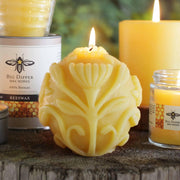 Big Dipper Wax Works Beeswax Sphere Candle, intricately designed with a black bee and yellow star, offering over 50 hours of warm, ambient glow.