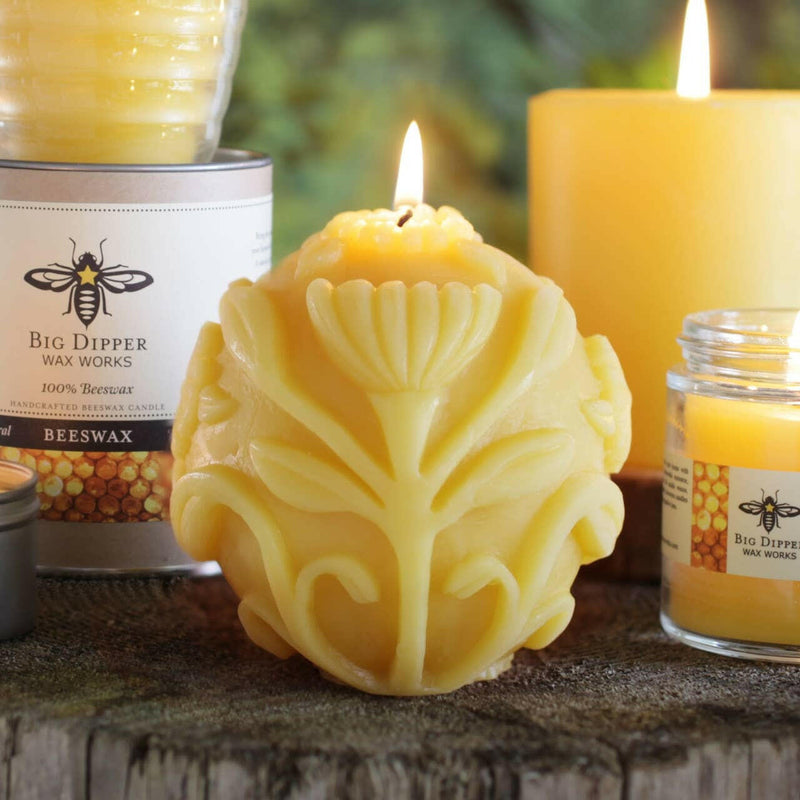 Big Dipper Wax Works Beeswax Sphere Candle, intricately designed with a black bee and yellow star, offering over 50 hours of warm, ambient glow.