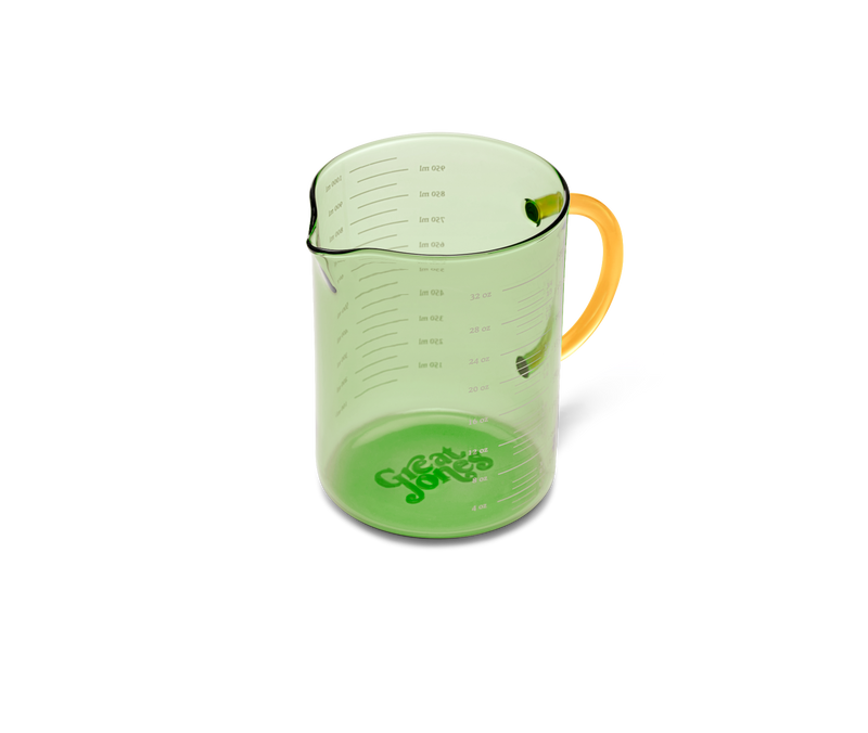 Great Jones | Beyond Measure 4-Cup - Broccoli-Butternut, a durable borosilicate glass measuring cup with precision-pour spout and clear measurements, ideal for kitchen prep and serving.