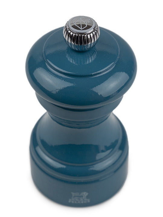 Peugeot | Bistro Salt Mill, Pacific Blue: A glossy teal, hand-held salt grinder with a knurled metal knob for coarseness control, made in France with a steel mechanism.