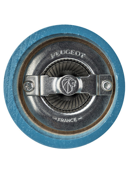 Close-up of Peugeot | Bistro Salt Mill's grinding mechanism, featuring serrated wheel, adjustment bridge, and Peugeot-France stamping, highlighting its durable craftsmanship.