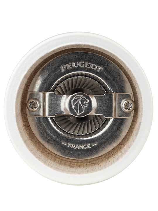 Underside view of the Peugeot | Bistro Salt Mill, Ivory, showcasing the metal grinding mechanism with “PEUGEOT FRANCE” and lion logo, highlighting its historic craftsmanship.
