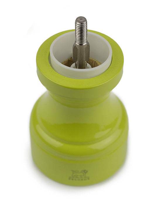 Peugeot | Bistro Salt Mill, Green Pistachio, with top removed, revealing ceramic grinding mechanism, inspired by the iconic 1874 design, available at Athens Cooks.