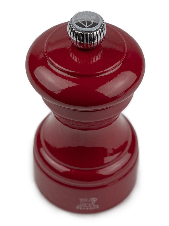 Peugeot | Bistro Salt Mill, Passion Red, featuring a hand-crank design and adjustable grinding knob. A classic French-made spice mill from Athens Cooks collection.