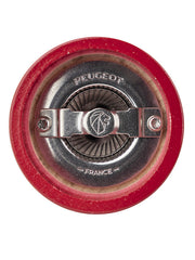 Peugeot | Bistro Salt Mill, Passion Red, features a metal grinding mechanism and adjustment plate in its red wooden body, embodying classic French design.