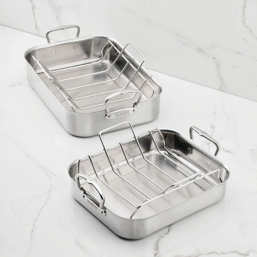 Hestan Provisions | Classic Roaster with Rack, 14.5 Inches, featuring two stainless-steel pans with wire racks on a marble countertop; ideal for versatile cooking.