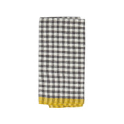 Caravan Home | 20 x 30 Gingham Grey & Dijon Towels: A folded tea towel with a black-and-white checkered pattern and a yellow border, ideal for a sunny kitchen.
