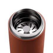 Top-down view of FELLOW | Carter Move Mug, Sienna / 16 oz, showing its stainless-steel interior with a slotted metal filter for tea or coffee.