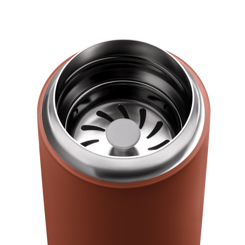 Top-down view of FELLOW | Carter Move Mug, Sienna / 16 oz, showing its stainless-steel interior with a slotted metal filter for tea or coffee.
