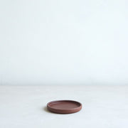 The Floral Society | Daily Plate, Sand—a low-profile round terracotta dish, ideal for holding candles or as a multi-purpose accent piece.