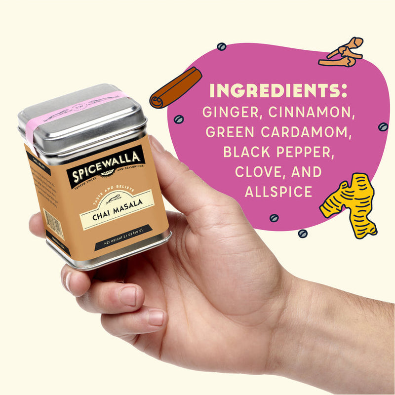 Spicewalla Chai Masala tin held in hand, featuring ingredients and brewing instructions for crafting Indian street-inspired chai, perfect for beverages, desserts, and baking.
