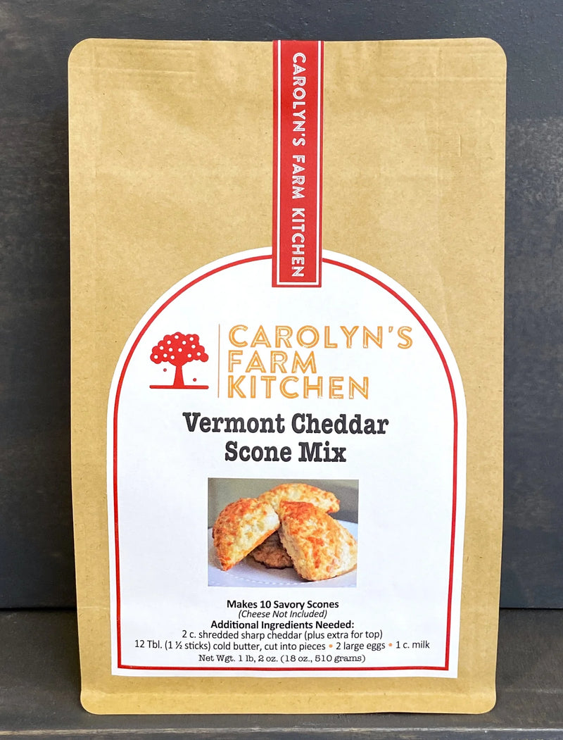 Carolyn's Farm Kitchen Vermont Cheddar Scone Mix in a kraft-paper pouch, featuring a label with scone image and ingredient details for making savory scones.