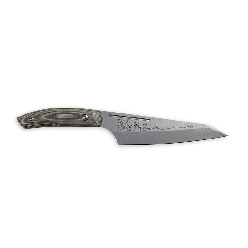Messermeister | Chef April Bloomfield Chef's Knife, 6.5 inches, featuring a decorative motif on the steel blade with a dark wooden handle, ideal for precision cooking.