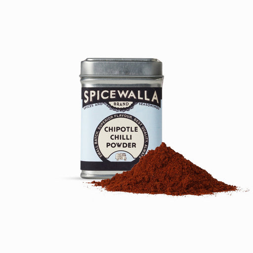 Spicewalla | Chipotle Chilli Powder tin with a small heap of powder, offering rich, smoky flavor ideal for enhancing dishes with a touch of heat.