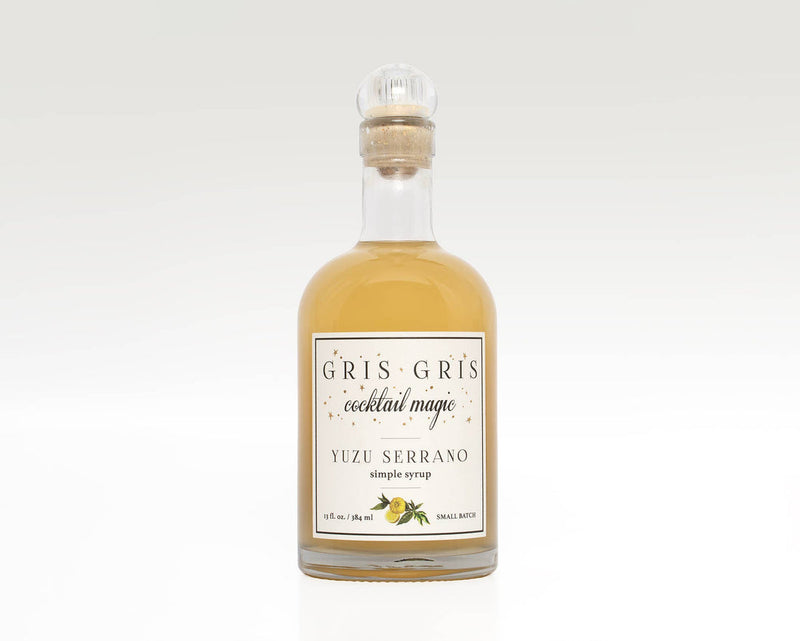 Gris Gris | Cocktail Magic Simple Syrup - Yuzu Serrano in a glass bottle with cork, featuring a white label, ideal for enhancing cocktails with a spicy, aromatic twist.