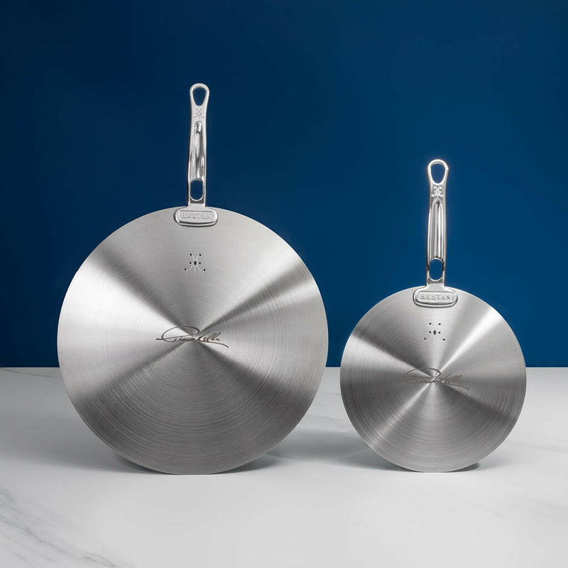 Hestan | Commercial Clad Stainless Steel Universal Lids - 11, featuring two round stainless-steel lids with handles, designed by Chef Thomas Keller for versatile, eco-friendly cooking.
