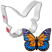Ann Clark | Cookie Cutters - Butterfly: close-up of butterfly-shaped cookie cutter, butterfly cookie, and logo, showcasing premium baking tool for creative baking projects.