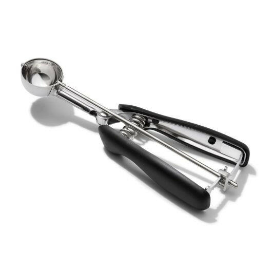 OXO Cookie Scoops - Large; a stainless steel tool with a spring-loaded handle and non-slip grip for easy dough release, perfect for uniform cookies.