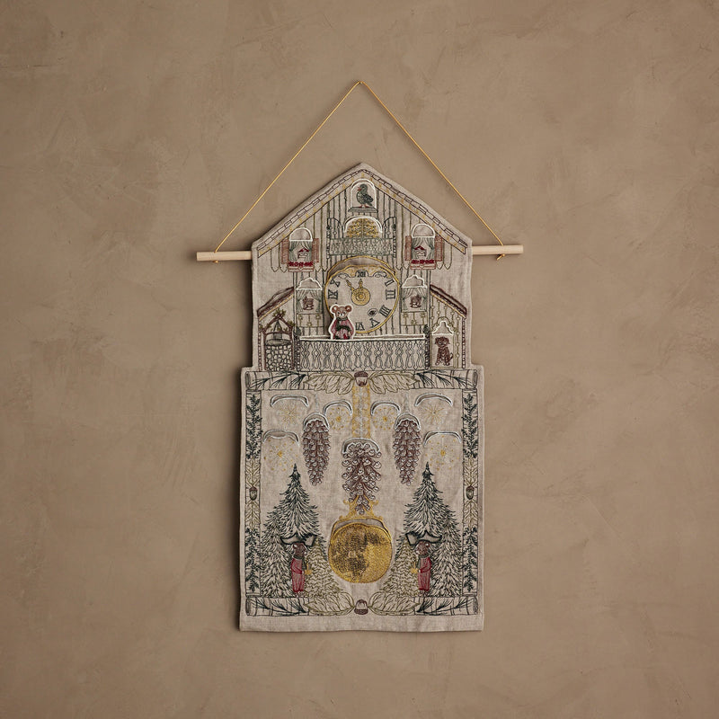 Coral & Tusk | Christmas Clock Advent Calendar: Linen house-shaped wall hanging with cuckoo clock embroidery, 25 gift pockets, and felt mouse counter, perfect for festive countdowns.