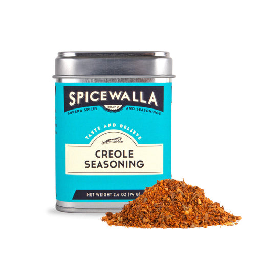 Spicewalla | Creole Blend tin with spilled spice, ideal for enhancing gumbo or jambalaya, showcasing its delicate, herbaceous Euro-classical flavor profile. Net weight: 2.6 oz/74 g.